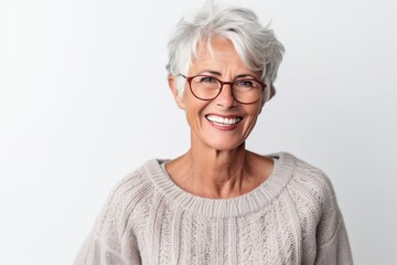 Portrait of smiling senior woman in eyeglasses looking at camera