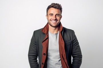 Fototapeta premium Portrait of a handsome man smiling at camera isolated on a white background