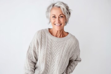 Portrait of a happy senior woman smiling at camera over white background