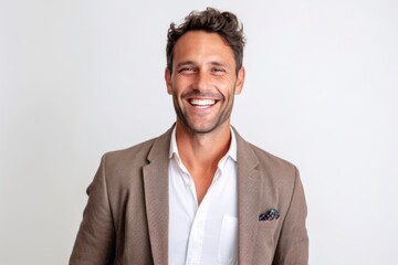 Close up portrait of a smiling handsome man looking at camera over white background