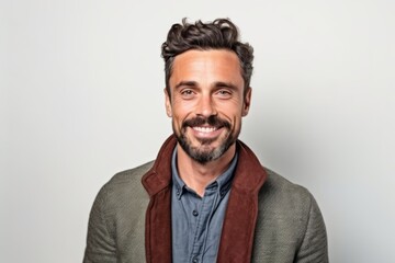 Obraz premium Portrait of a handsome man smiling at camera on a white background