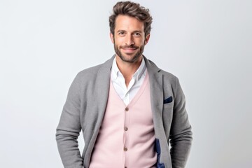 Fototapeta premium Portrait of a happy casual man standing with hands on hips over white background