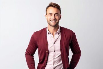 Fototapeta premium Portrait of a handsome young man smiling. Isolated white background.