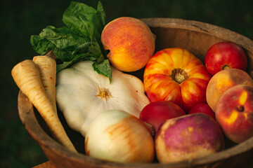 A wooden bowl filled with colorful fruit and vegetable ingredients