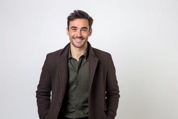 Fototapeta premium Portrait of a handsome young man smiling and looking at the camera