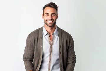 Fototapeta premium Portrait of a handsome young man smiling at the camera on a white background