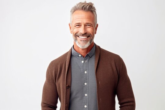 Medium shot portrait photography of a satisfied man in his 50s that is wearing a chic cardigan against a white background . Generative AI