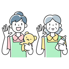 笑顔で応える女性保育士の上半身