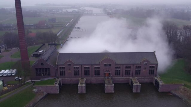 Slowly rising up shot of oldest pumping station in the world (Woudagemaal) Aerial 4k