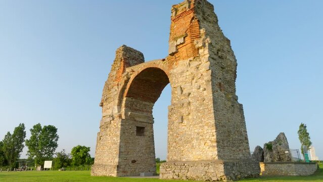 Heidentor Old Roman City Gate At Carnuntum Archeological Site In Austria - drone shot