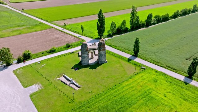 Roman Ancient Ruins Gate Heidentor, Petronell Carnuntum, Austria - aerial drone shot