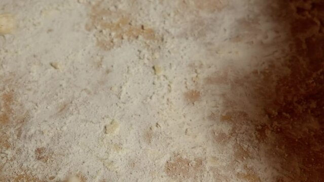 hadn shreding dough into pieces to start making fattah