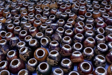 Photo of colorful vases displayed on a table, showcasing the vibrant artistry of Argentina