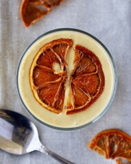 vegan pudding dessert topped with dried fruit in a cup
