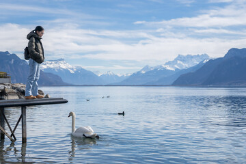 Woman with Swans at  Lake Geneva Vevey, Switzerland.