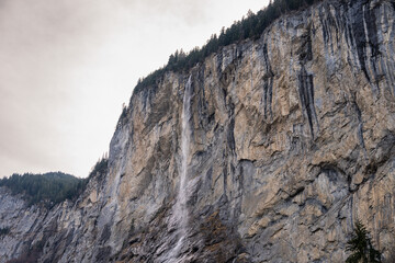 Staubbach Falls Kirche nature during winter in Lauterbrunnen, Switzerland.