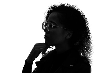 Profile silhouette of thinking black woman in studio shot.