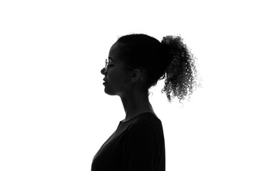 Profile silhouette of thinking black woman in studio shot.