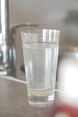 dirty glass of water on table 