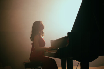 The woman plays the piano