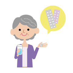 薬を飲むシニア女性