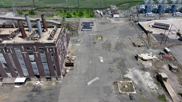 Aerial, panning view of a decommissioned coal power plant in Sayreville, NJ