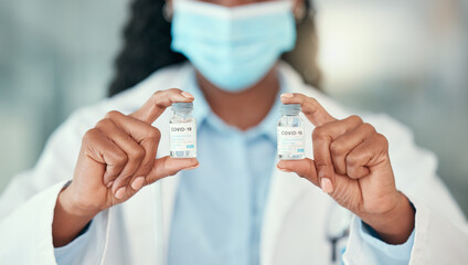 Doctor hands, covid and black woman with vaccine vials for virus or corona. Bottles, medical...
