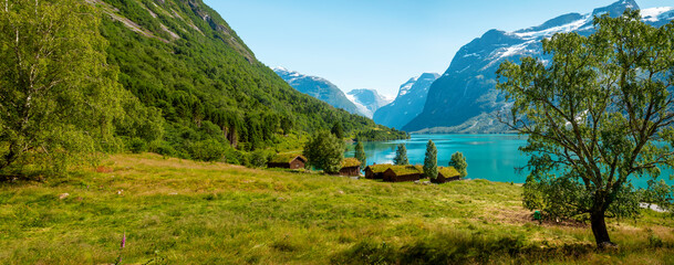 Panorama of norwegian landscape with traditional farm village