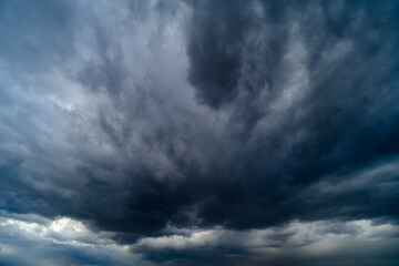 storm sky, dark dramatic clouds during thunderstorm, rain and wind, extreme weather, abstract...