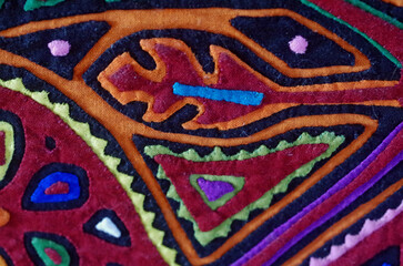 Closeup of handmade Guna mola (appliqué, trapunto)  textile pattern made by indigenous tribal people of Panama and Colombia