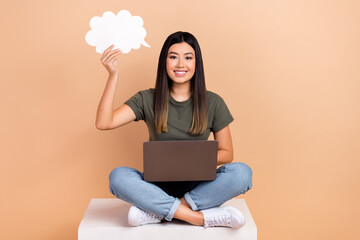 Full length photo of young woman sit box smart hold speech bubble cloud idea brainstorming use...