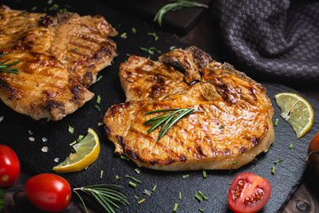 Grilled beef steak with spices on a stone background