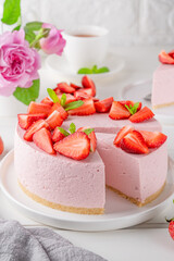 No bake cheesecake with fresh strawberries on a white wooden background. Summer dessert. Selective focus. Copy space.
