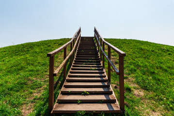 Stairs to heaven.Stairs into the future.wooden stairs at mountain.Summer day.