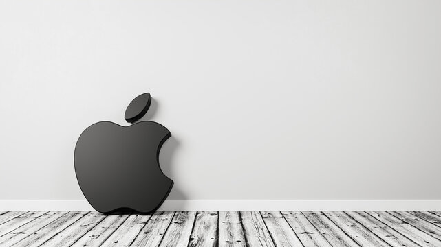 Apple Inc. Company Logo on Wooden Floor Against Wall