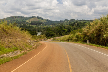 Fototapeta na wymiar Paved road near Rweetera village in the crater lakes region near Fort Portal, Uganda