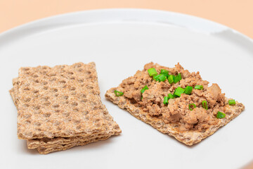 Crispy Sandwich with Chicken Pate and Green Onions on White Plate. Whole Grain Bread with Liver Pate. Diet Breakfast and Healthy Food