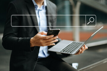Searching Browsing Internet Data Information Networking Concept with blank search bar.man working with mobile phone and laptop computer VR icon in office.