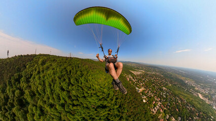 Paragliding man flying alone in Budapest, adventure concept