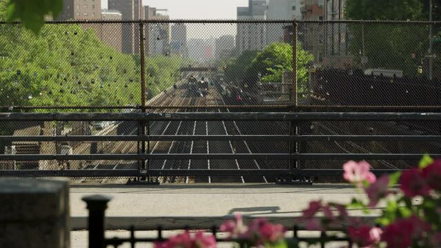 New York City &mdash; Commuter Trains Approach And Pass Under Street On Manhattan's Upper East Side