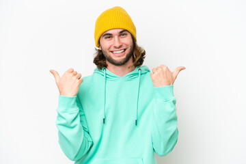 Young handsome man isolated on white chroma background with thumbs up gesture and smiling