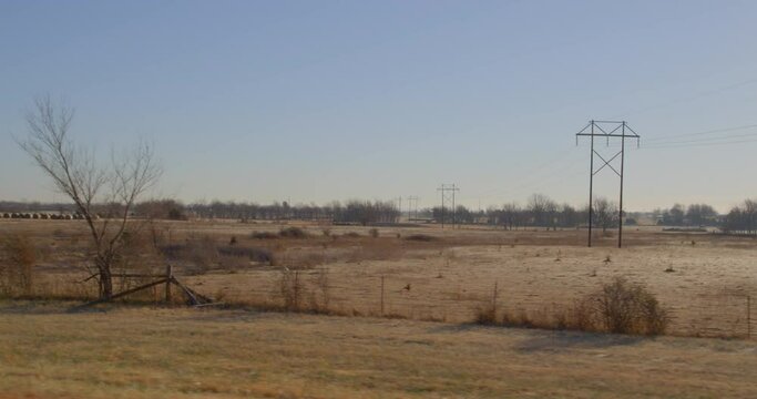 Rural farmland in Texas countryside on sunny winter day.