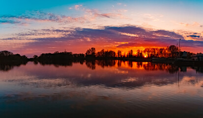 Sunset with reflections near Plattling, Isar, Bavaria, Germany