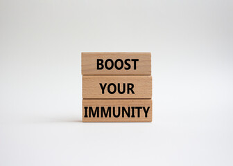Boost your immunity symbol. Concept word Boost your immunity on wooden blocks. Beautiful white background. Helthcare and Boost your immunity concept. Copy space