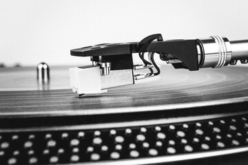 Fototapeta na wymiar Turntable vinyl record player close up. Retro style toned image