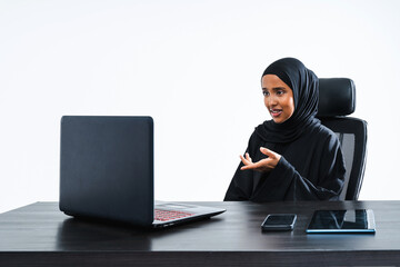 Beautiful arab middle-eastern corporate businesswoman with traditional abaya dress working in the office