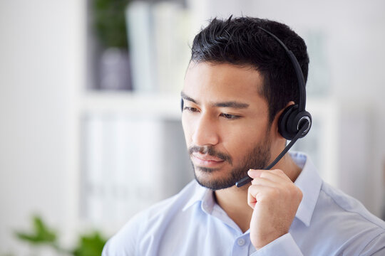 Man, focus and agent with telemarketing, call center and help with customer service, thinking and professional. Male person, serious employee or consultant with tech support, headset or concentration