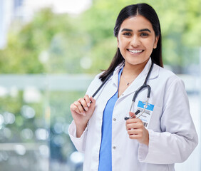 Young woman, doctor and hospital portrait with smile, stethoscope and healthcare career with pride....