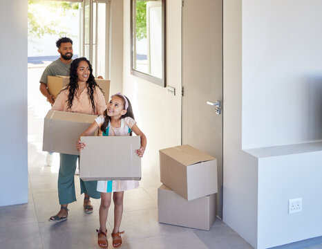 Happy family, real estate and moving in new home with box for property, mortgage loan or relocation. Mother, father and child homeowner carrying boxes together for renovation in apartment or house