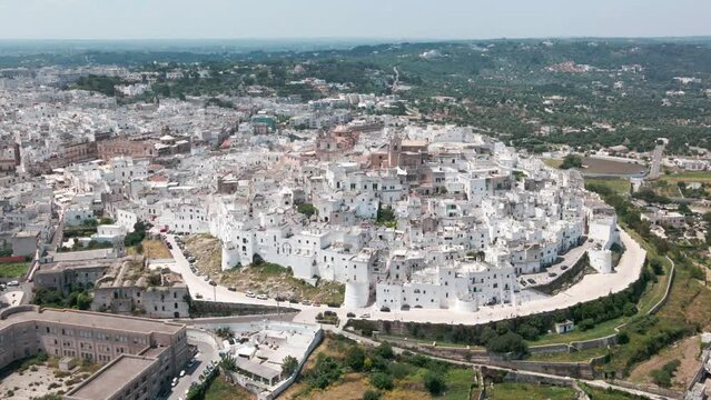 Panoramic view of the whole city of Ostuni in the Puglia region of Italy. White city drone view